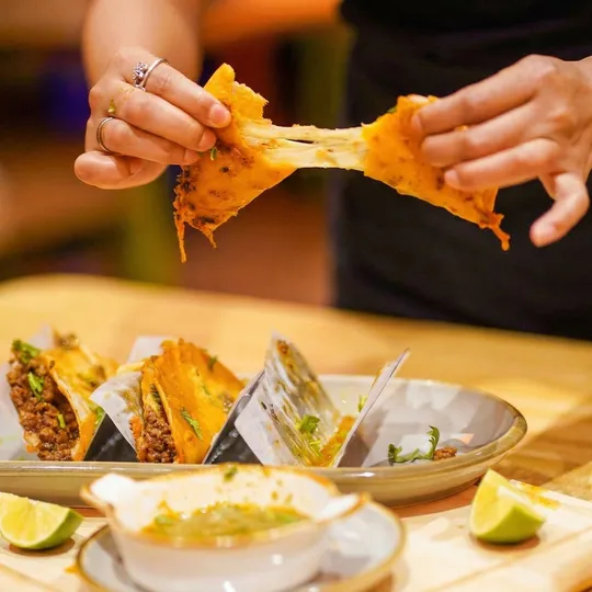 Birria taco cheese pull with consomme dipping at Ixtapa Mexican Restaurant, Lunenburg MA