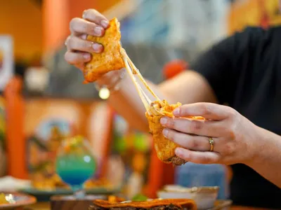 Cheesy grilled quesadilla with melted cheese pull at Ixtapa Mexican Restaurant, Lunenburg MA