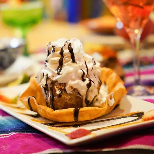 Fried ice cream in tortilla bowl with chocolate drizzle at Ixtapa, Lunenburg MA
